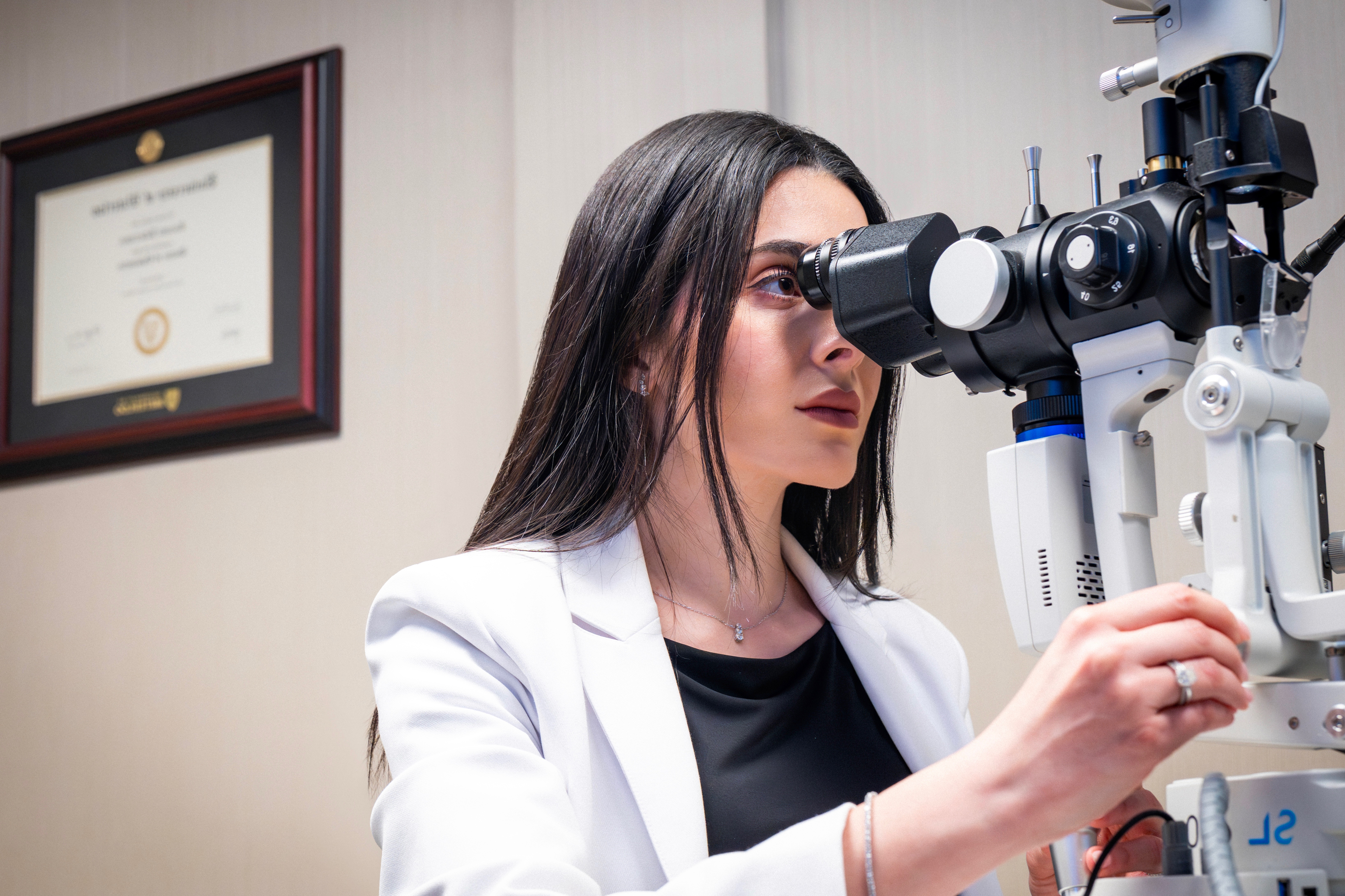 Dr. Roxana Ramzi performing an eye examination